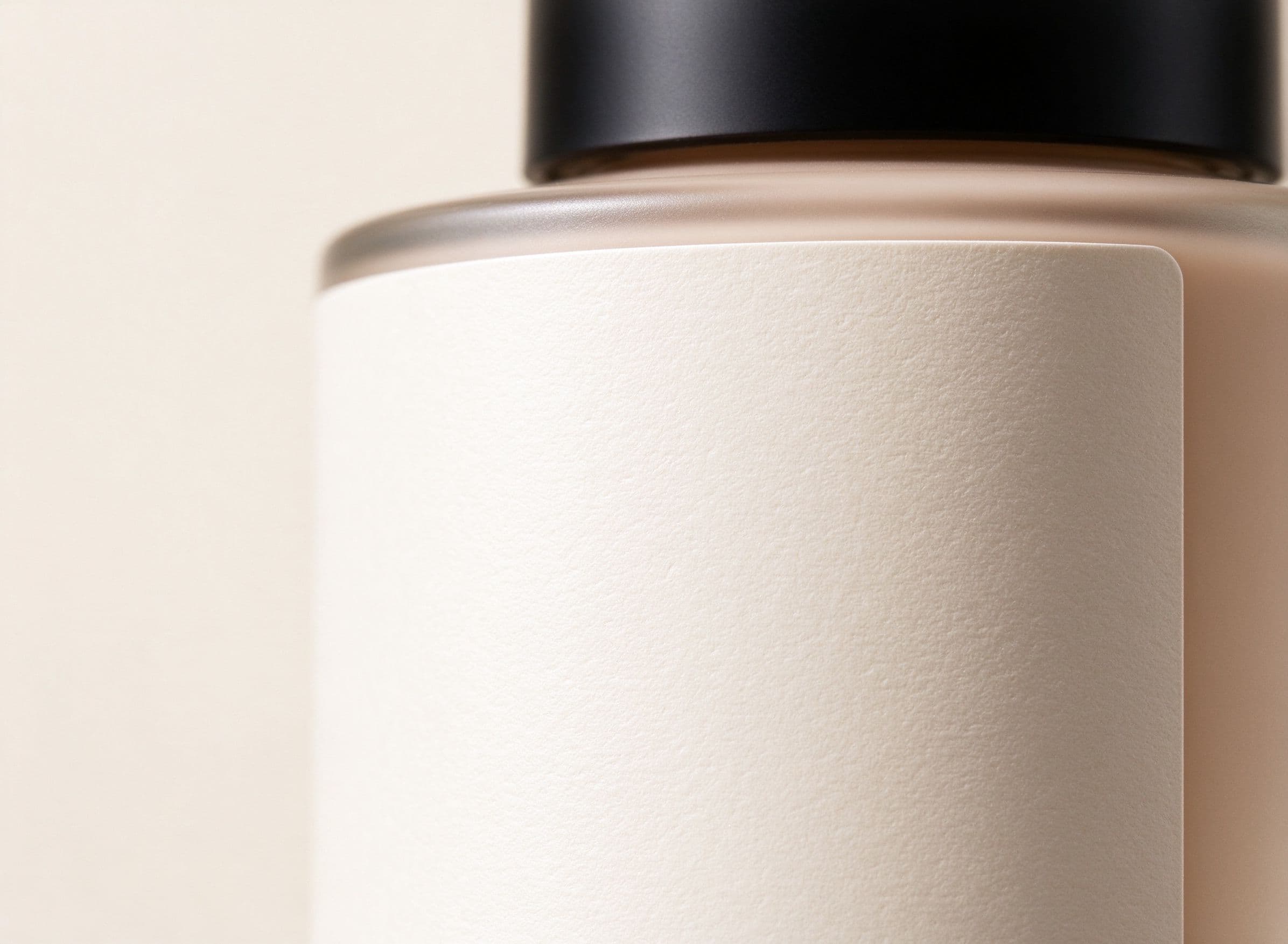 Soft-touch matte label surface on a cosmetic bottle